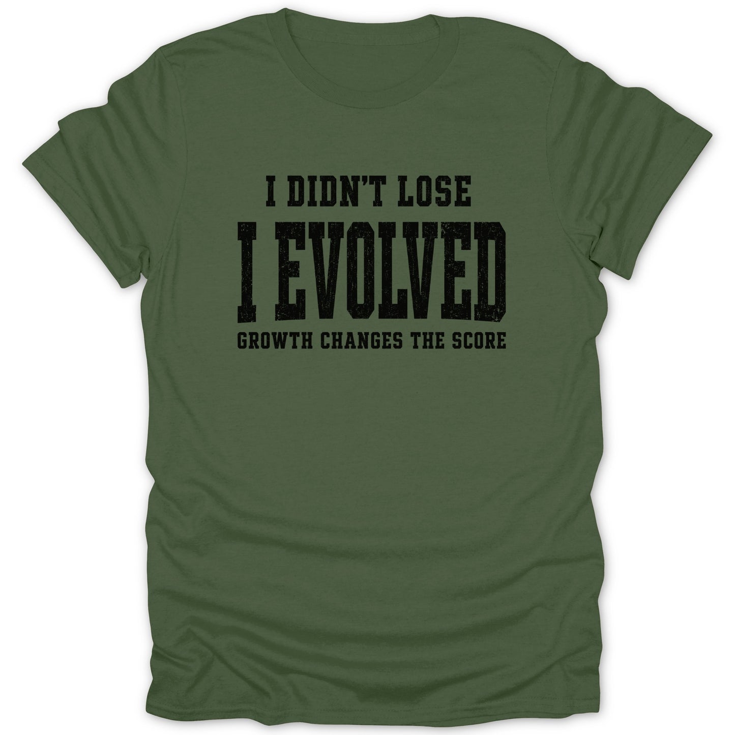 Green t-shirt with black text that reads "I DIDN'T LOSE I EVOLVED GROWTH CHANGES THE SCORE".