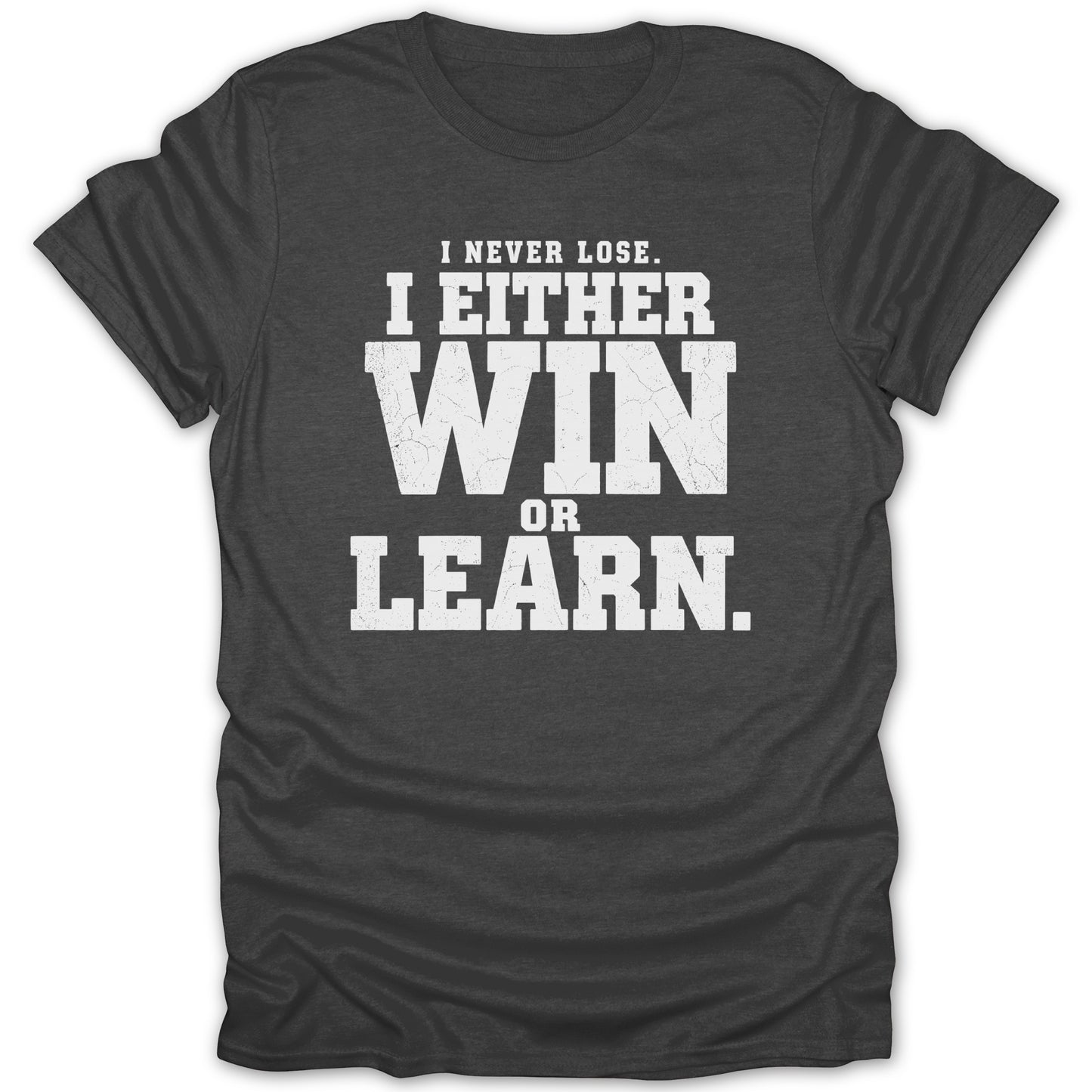 Dark grey t-shirt with white text: "I NEVER LOSE. I EITHER WIN OR LEARN."