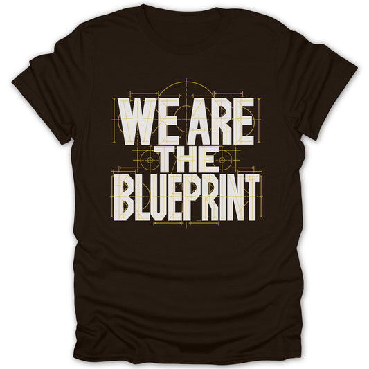 Dark brown t-shirt with white text "WE ARE THE BLUEPRINT" in blueprint style.