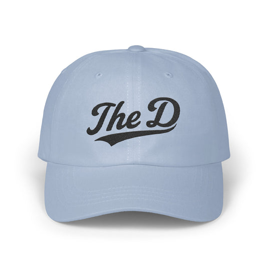 Light blue baseball cap with black "The D" text logo.