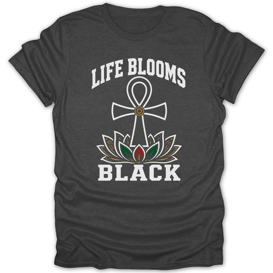 Dark t-shirt with white text "LIFE BLOOMS BLACK" and an Ankh symbol over a lotus.