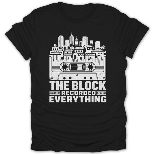 Black t-shirt with white graphic of a cassette tape, city skyline, and text.