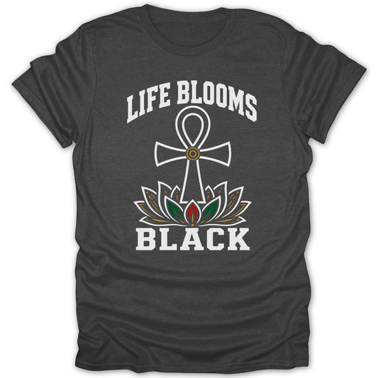 Dark t-shirt with white text "LIFE BLOOMS BLACK" and an Ankh symbol over a lotus.