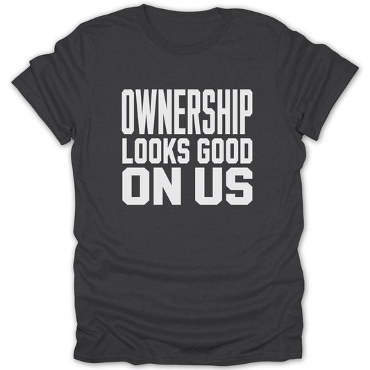 Dark gray t-shirt with white text saying "OWNERSHIP LOOKS GOOD ON US".