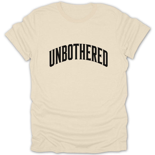 Cream t-shirt with black text that reads "UNBOTHERED" in a curved font.