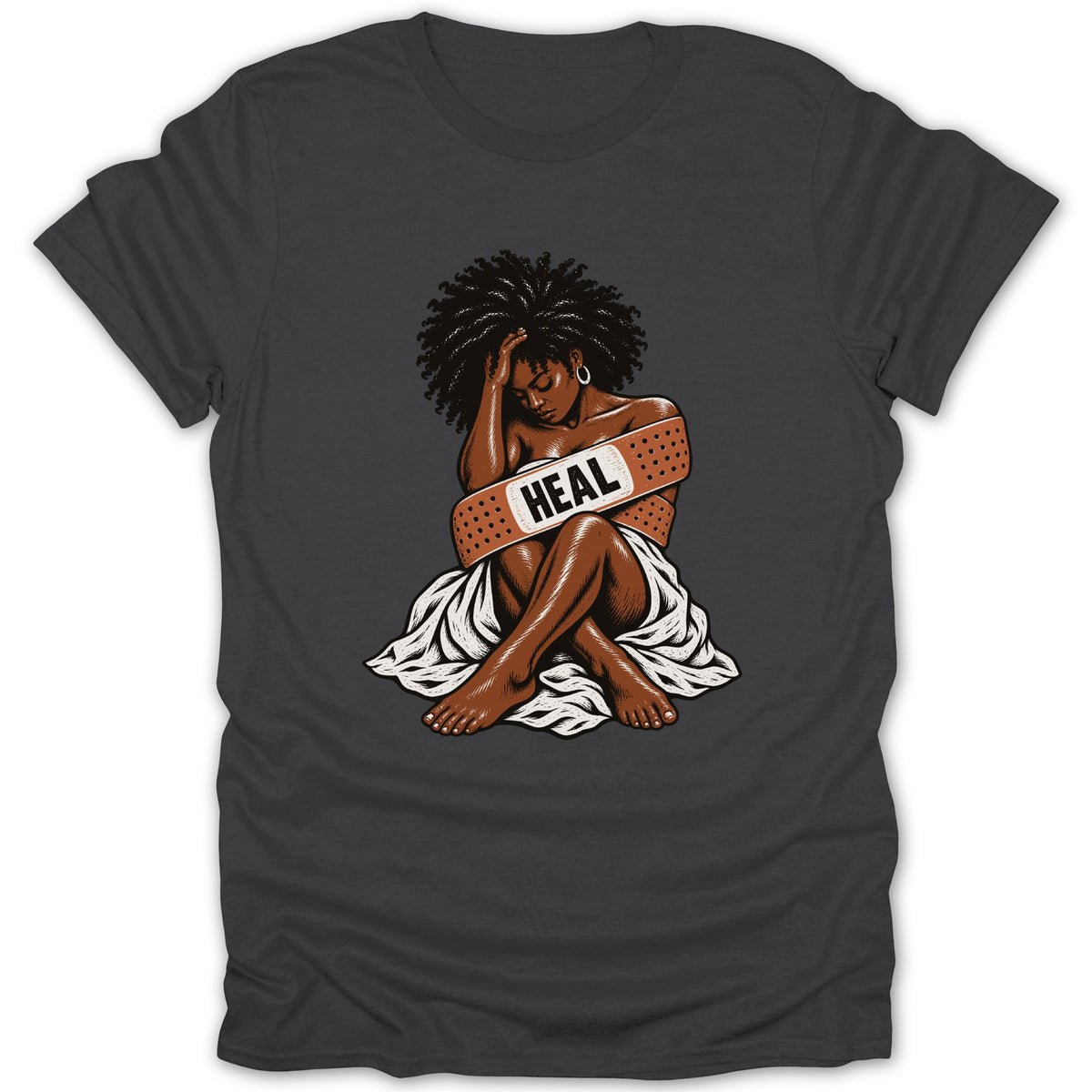 Woman with band-aid saying "HEAL" across her chest, sitting with head bowed.
