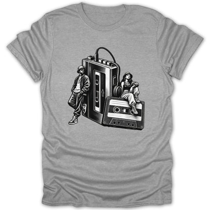Black and white illustration of two people and a large cassette player on a grey t-shirt.