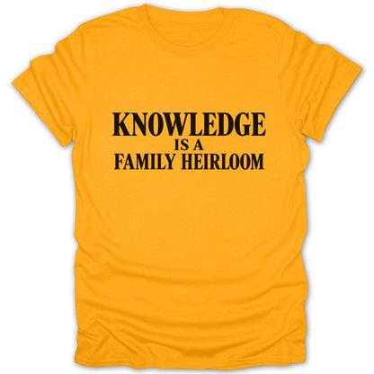 Gold short-sleeve crewneck t-shirt featuring black text that reads KNOWLEDGE IS A FAMILY HEIRLOOM.