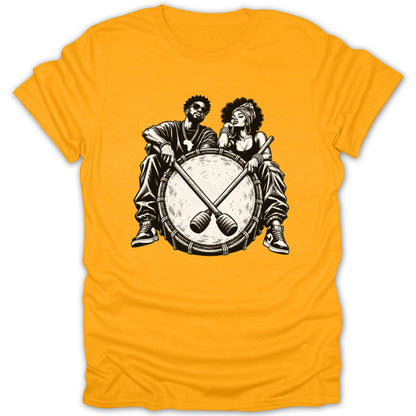 Black and white illustration of a couple sitting on a drum with drumsticks.