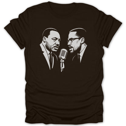 Martin Luther King Jr. and Malcolm X facing a microphone on a dark t-shirt.