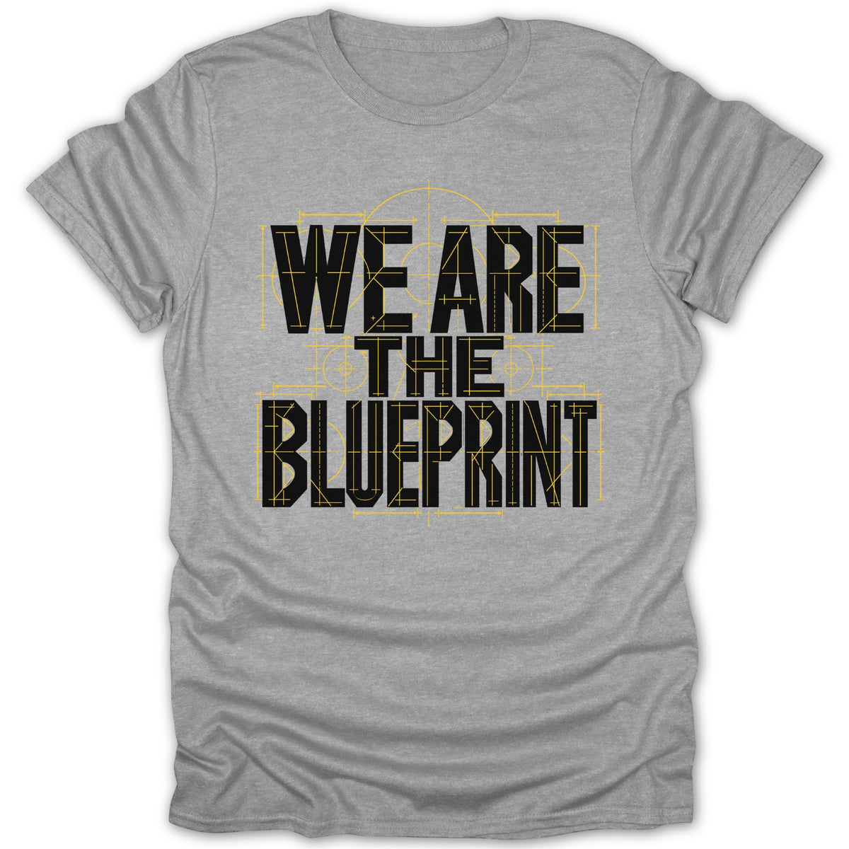 Grey t-shirt with black text "WE ARE THE BLUEPRINT" over yellow blueprint lines.