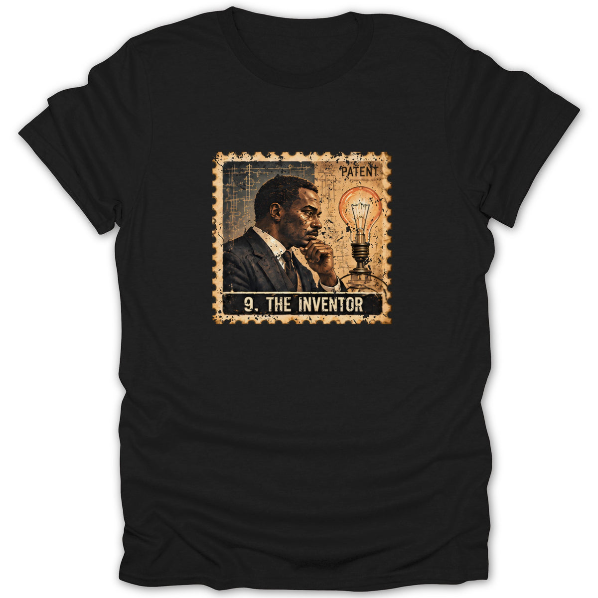 A black t-shirt printed with a vintage postage stamp design featuring a man, lightbulb, and text reading 9. The Inventor.