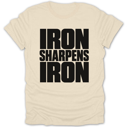 A cream-colored t-shirt with bold black text reading "Iron Sharpens Iron" centered on the chest.