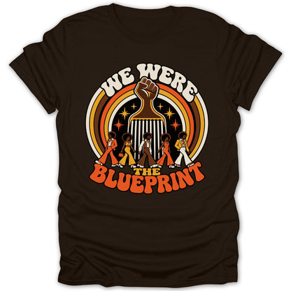 Brown t-shirt with retro graphic: "We Were The Blueprint" with afro combs.