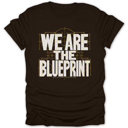 Dark brown t-shirt with white text "WE ARE THE BLUEPRINT" in blueprint style.