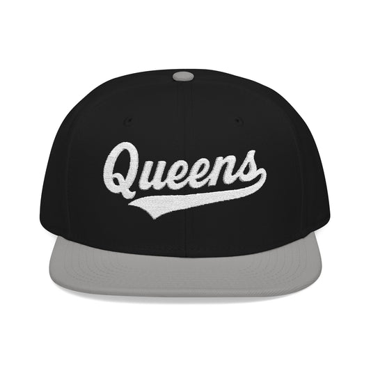 Black snapback hat with "Queens" in white script embroidery.