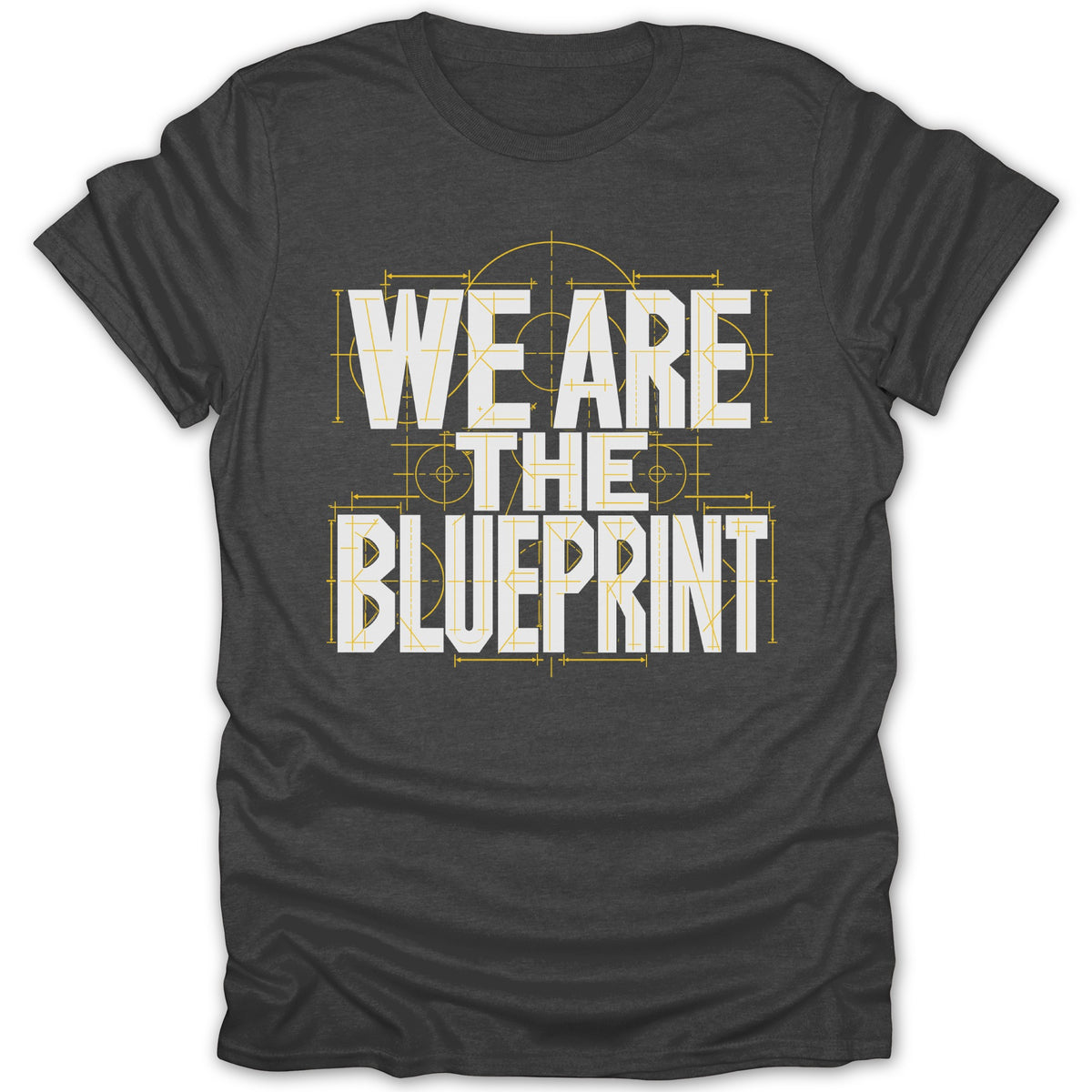Dark gray t-shirt with white text "WE ARE THE BLUEPRINT" over a blueprint design.
