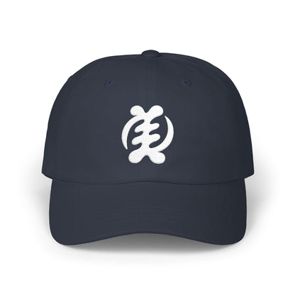 Dark blue baseball cap with white Sankofa symbol embroidered on front.