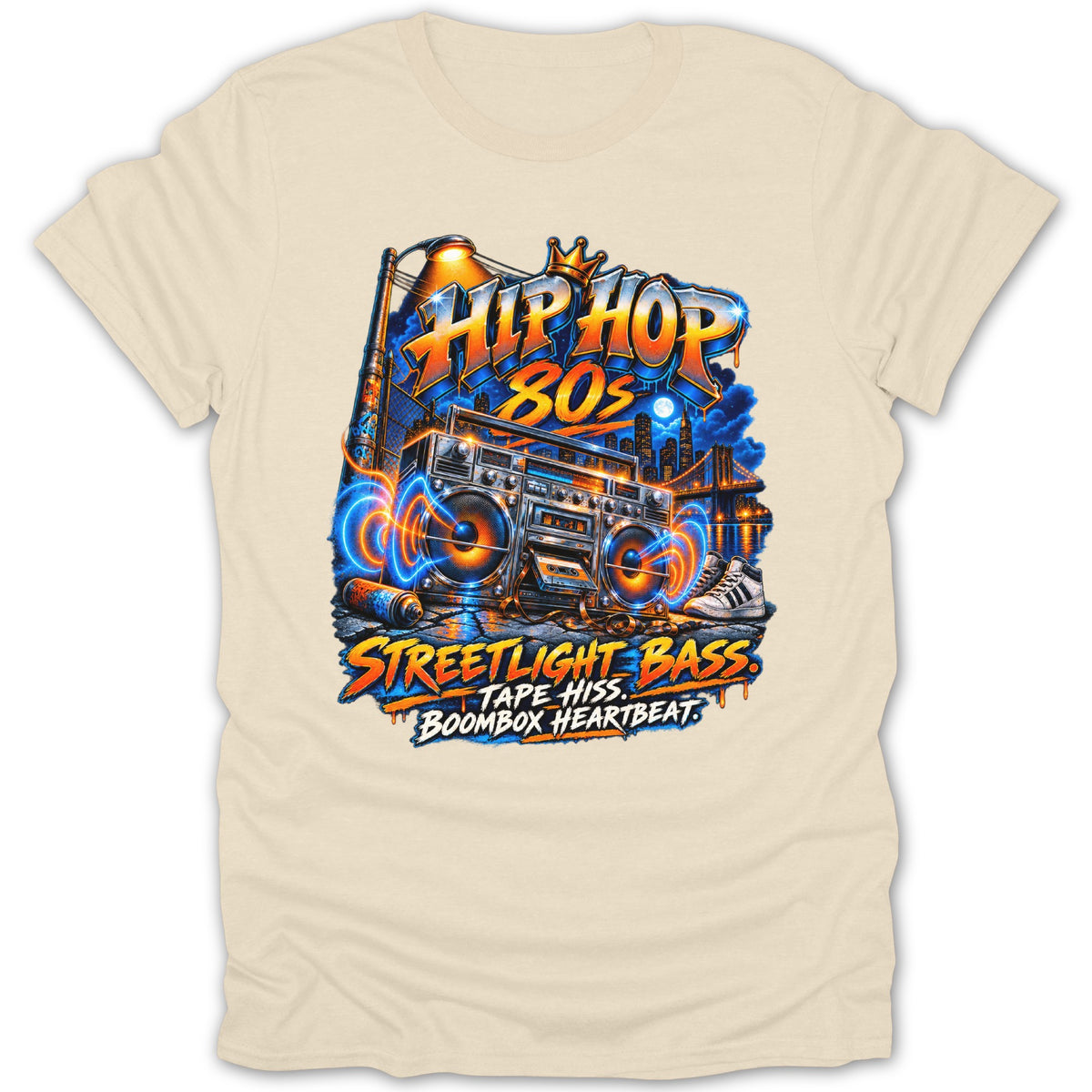 Graphic of a boombox with "Hip Hop 80s" and street scene, on a cream t-shirt.