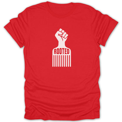 A red short-sleeve t-shirt with a white graphic of an afro pick blending into a raised fist, featuring the text ROOTED.