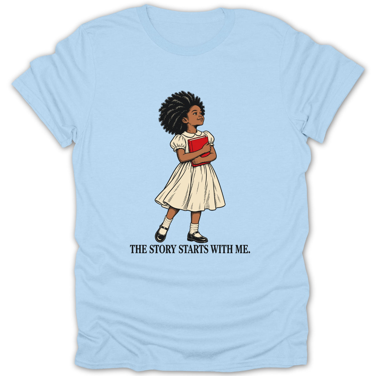 Light blue t-shirt with illustration of a girl holding a book, text reads "The Story Starts With Me."