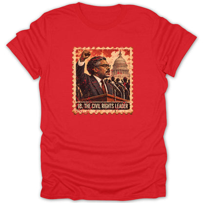 A red crew-neck t-shirt featuring a postage stamp graphic of a civil rights leader with a raised fist before the US Capitol.