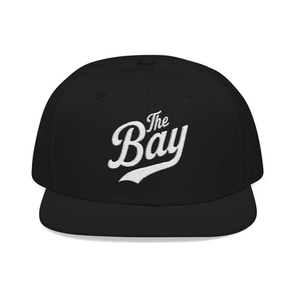 Black baseball cap with white embroidered text "The Bay".