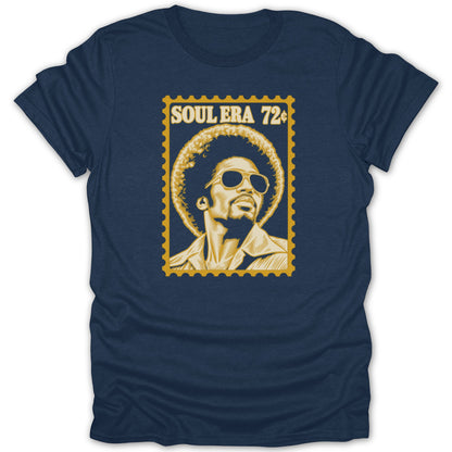 A navy blue t-shirt featuring a yellow graphic of a man with an afro and sunglasses, styled like a postage stamp with the text SOUL ERA 72¢.