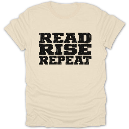 Cream t-shirt with black text reading "READ RISE REPEAT"