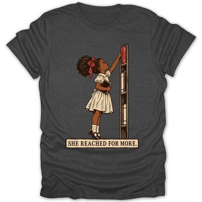 Girl reaching for a book on a shelf with text "SHE REACHED FOR MORE."