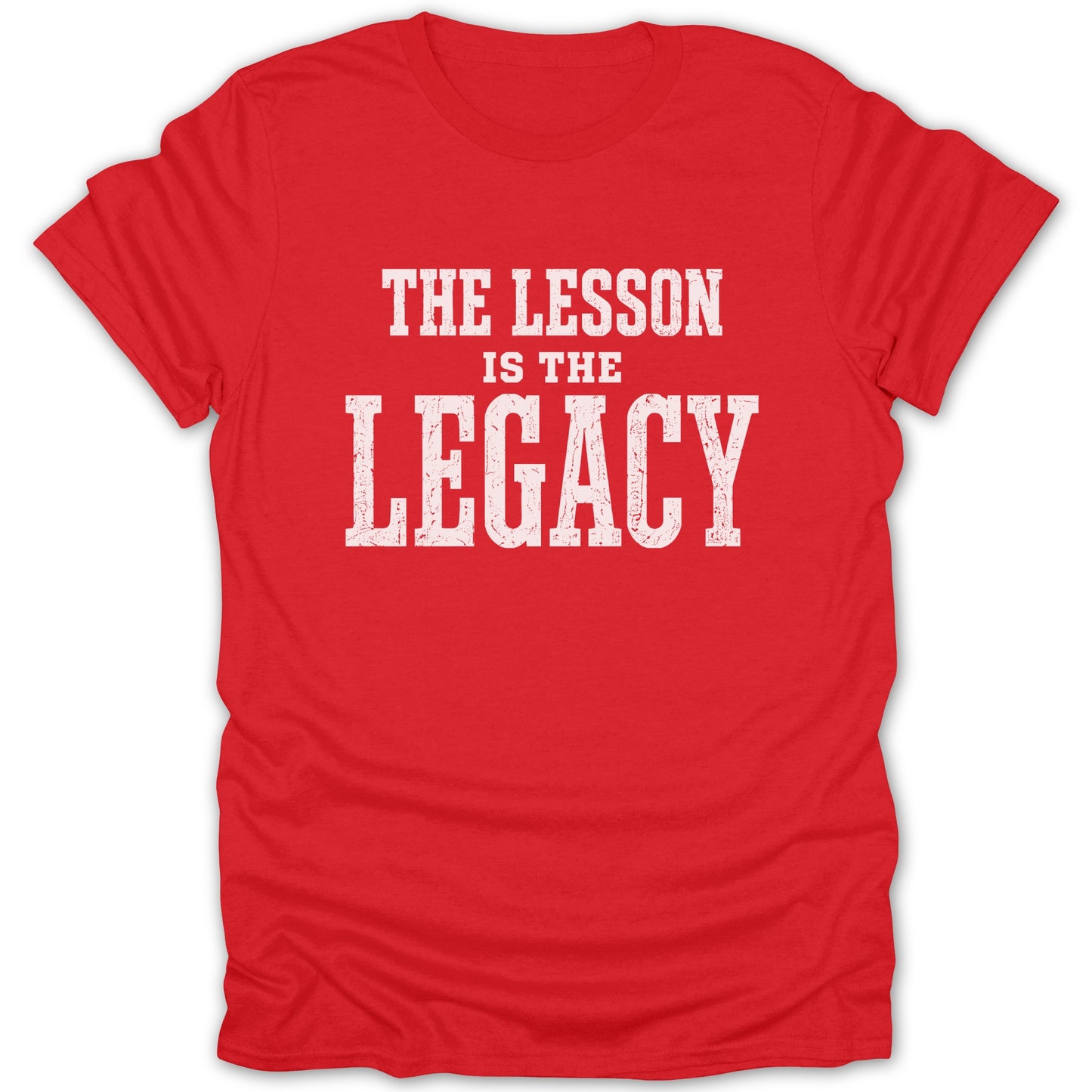 Red t-shirt with white text reading "THE LESSON IS THE LEGACY".