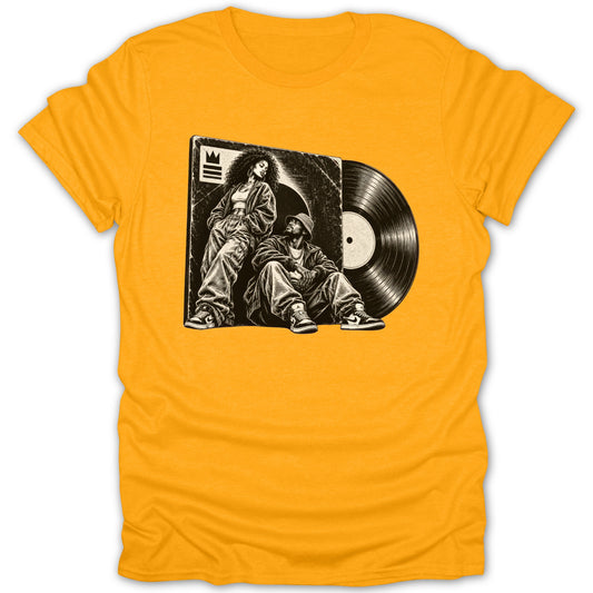 Graphic on yellow t-shirt depicts a vinyl record and two people in streetwear.