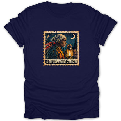 A navy blue crewneck t-shirt featuring a vintage postage stamp graphic of a woman holding a lantern beneath a crescent moon, with text reading "4. THE UNDERGROUND CONDUCTOR."