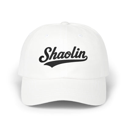 White baseball cap with "Shaolin" text in black script.