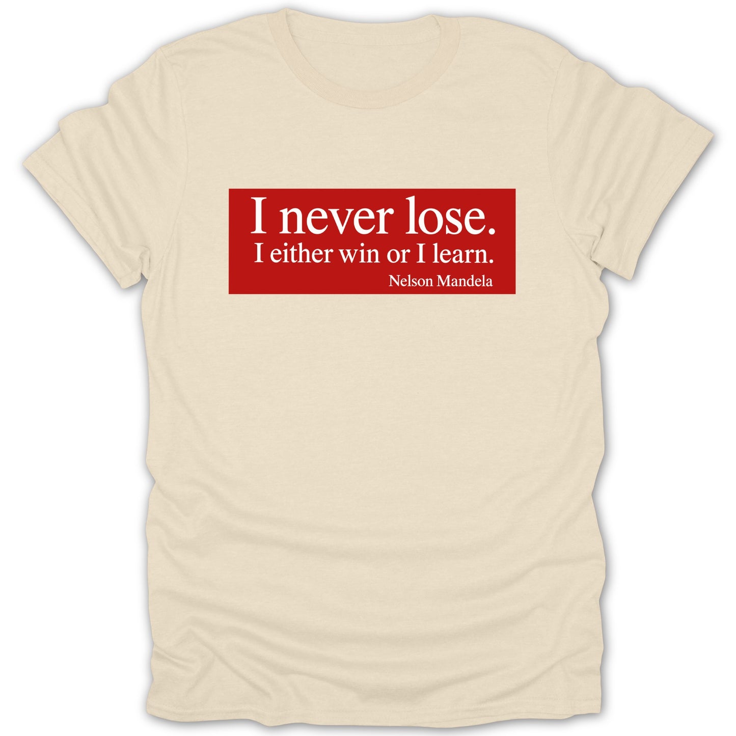 Cream t-shirt with red rectangle featuring Nelson Mandela quote.