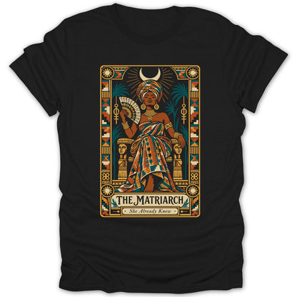 Illustration of a woman titled "The Matriarch. She Already Knew." on black t-shirt.