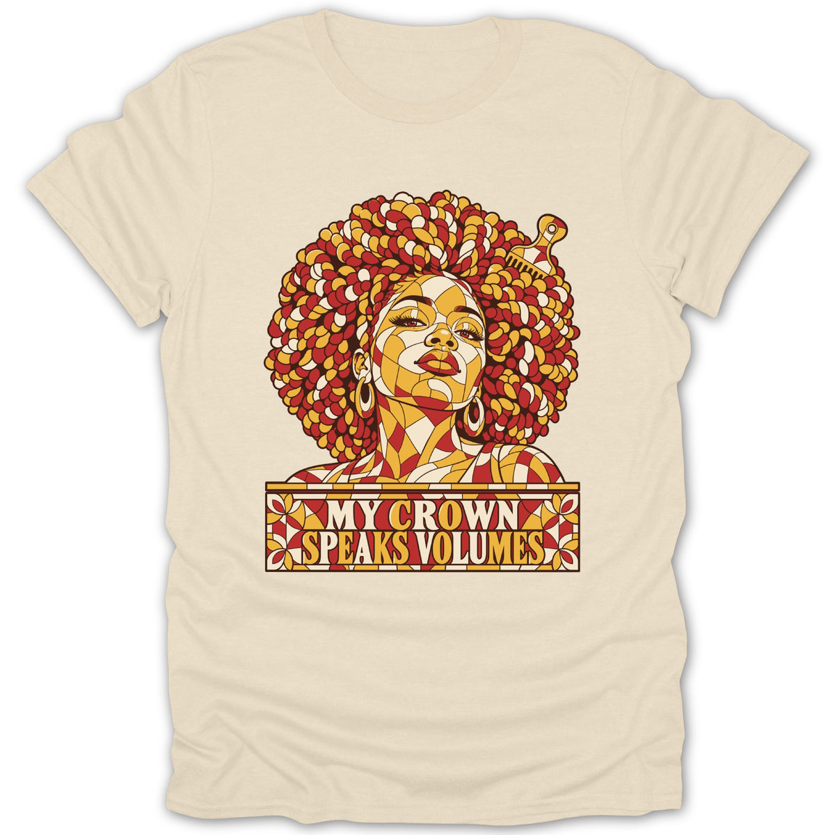 A cream-colored t-shirt featuring a stained glass style graphic of a Black woman with an afro and the text "MY CROWN SPEAKS VOLUMES".