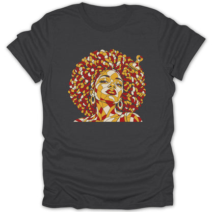 A dark gray t-shirt featuring a colorful geometric illustration of a woman with an afro and pick.