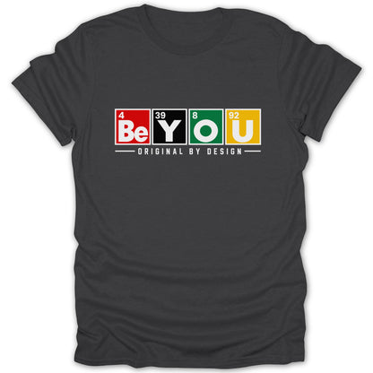 Dark grey t-shirt with "BeYOU" in periodic table style blocks and "Original by Design".