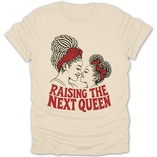 Beige t-shirt featuring a black and red illustration of a mother and daughter with the text Raising the Next Queen.