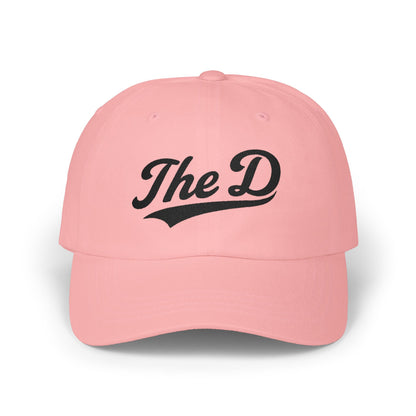 Pink baseball cap with "The D" in black cursive text.