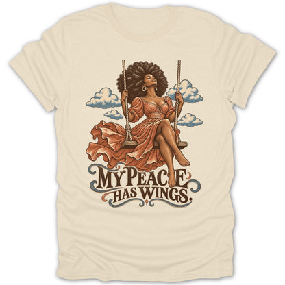 Woman with afro on swing with clouds and text "My Peace Has Wings."