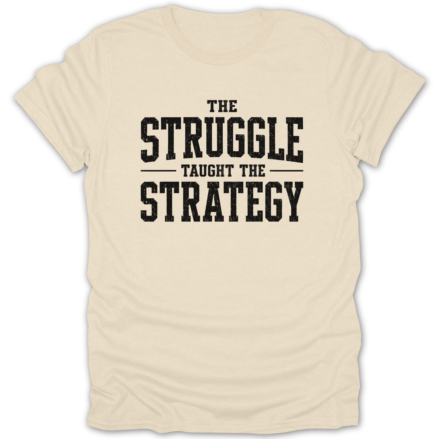 Cream t-shirt with black text "The Struggle Taught The Strategy"
