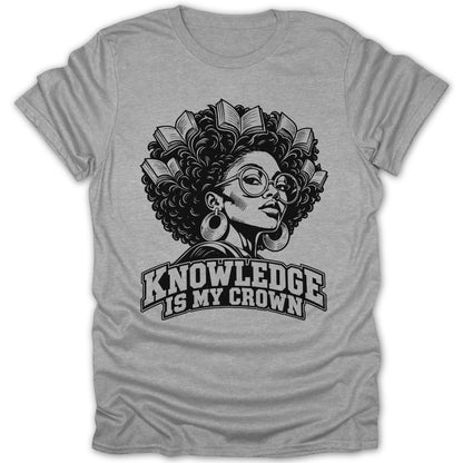 Black and white graphic of a woman with books in her hair on a grey t-shirt, reading "Knowledge is my crown."