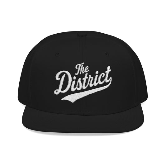 Black flat-brimmed hat with "The District" embroidered in white script.