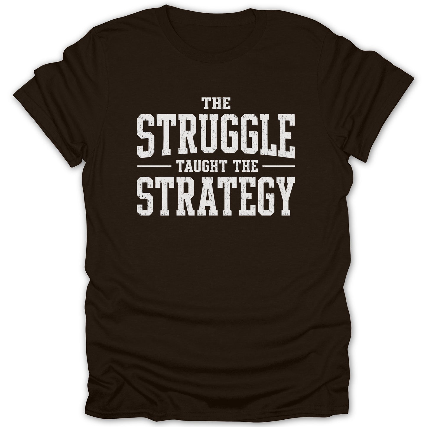 Brown t-shirt with white text reading "The Struggle Taught The Strategy".