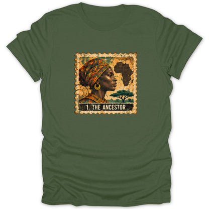 An olive green t-shirt featuring a postage stamp graphic with a portrait, an African map silhouette, and the text "1. THE ANCESTOR".