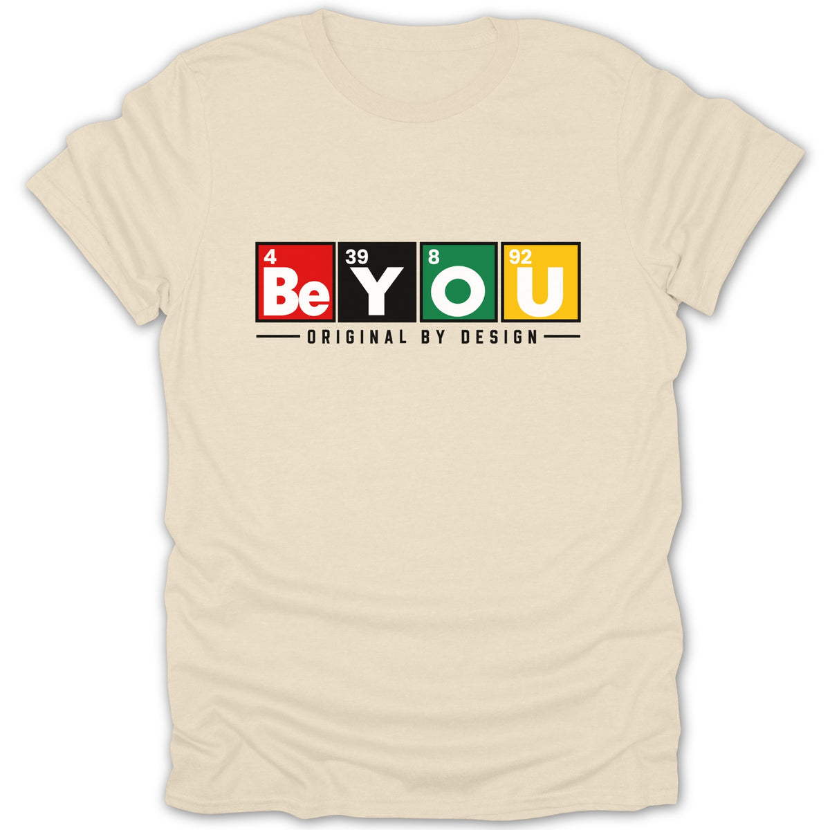 Light beige t-shirt with "Be YOU ORIGINAL BY DESIGN" text in periodic table style.