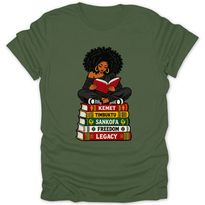 Black woman reading book seated on stack of books: Kemet, Timbuktu, Sankofa, Freedom, Legacy.
