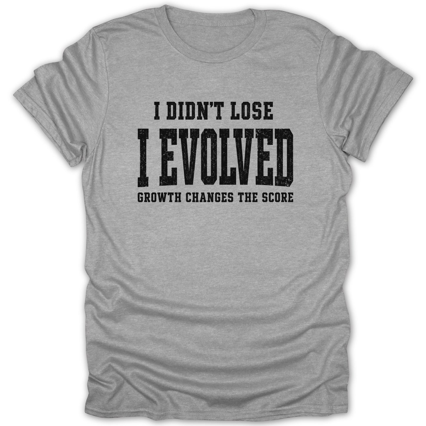 Grey t-shirt with black text: "I DIDN'T LOSE I EVOLVED GROWTH CHANGES THE SCORE"
